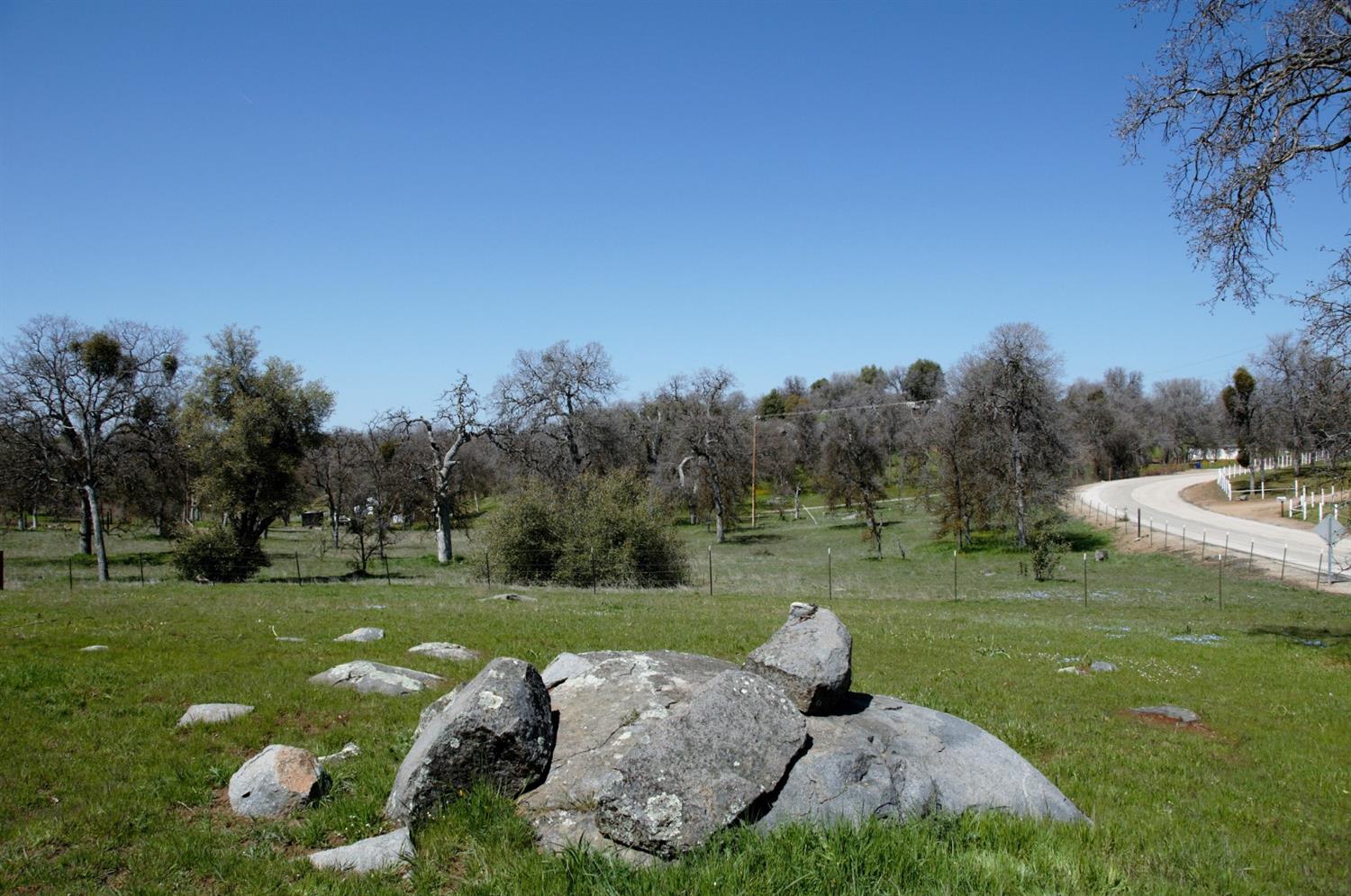 a view of a golf course with a lake view