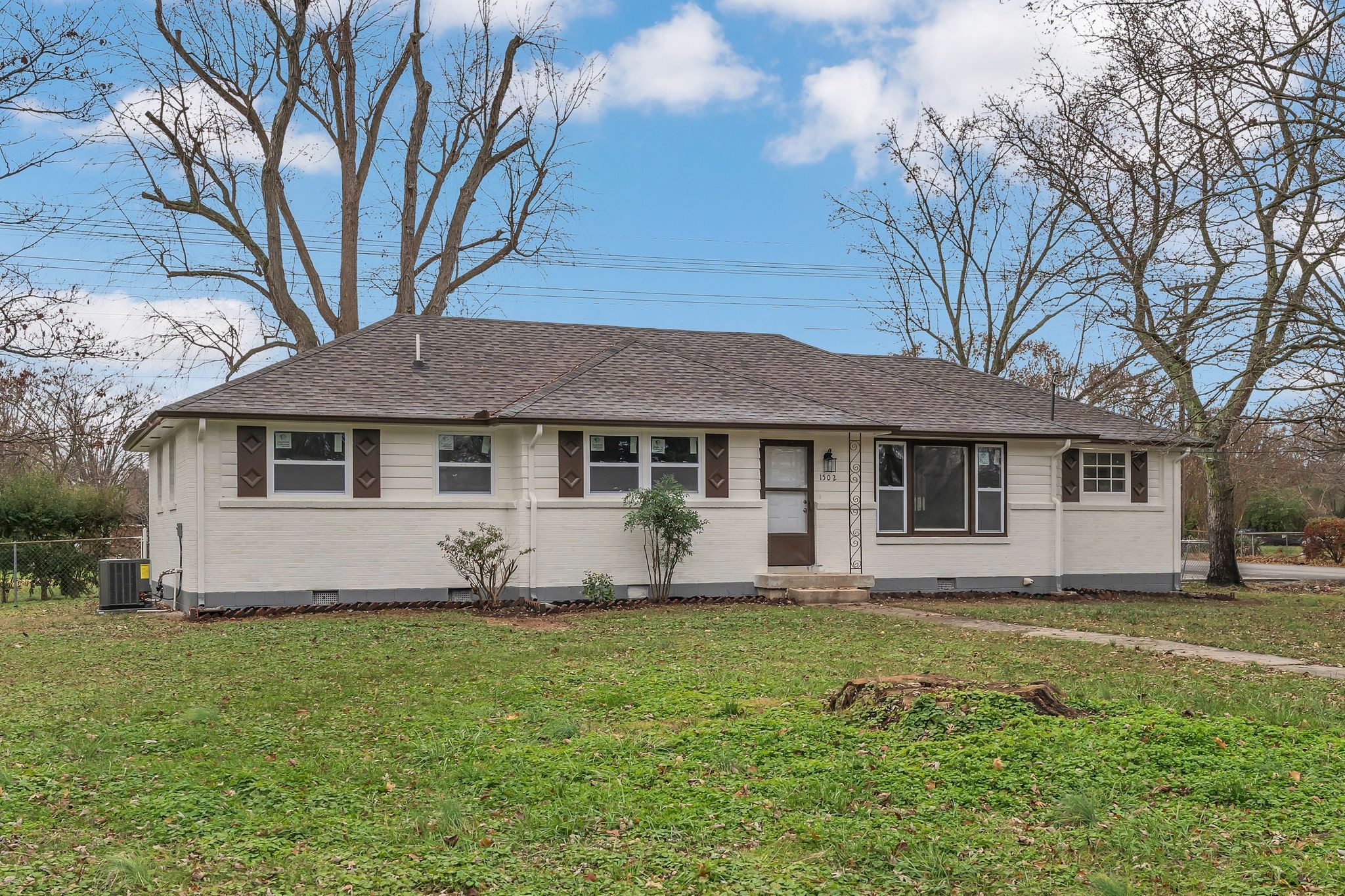 a front view of a house with a yard