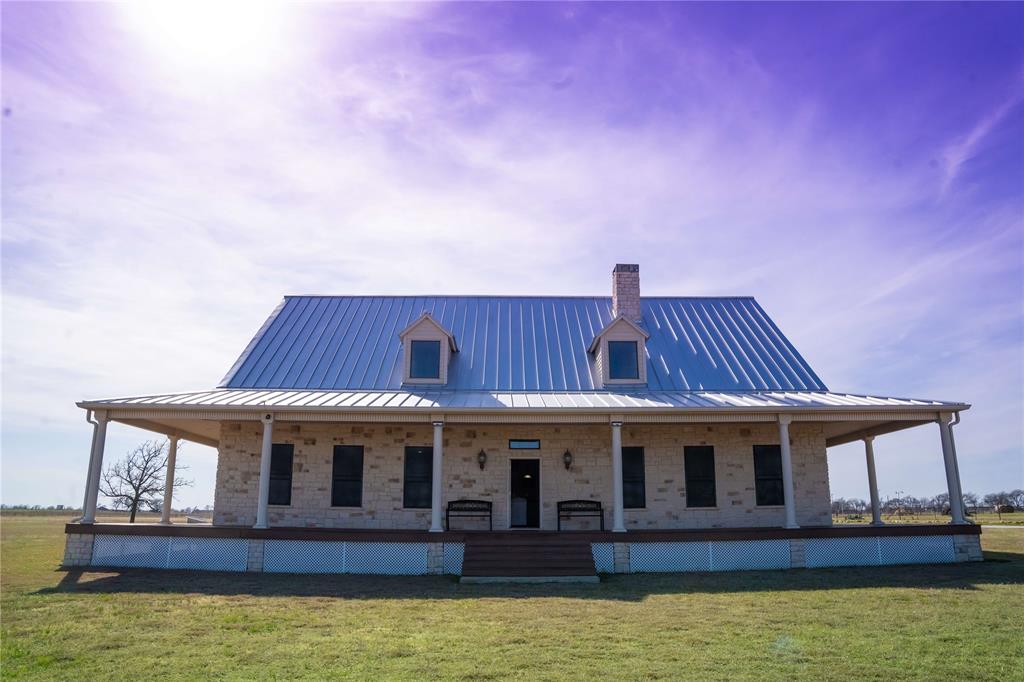 a front view of a house with large windows