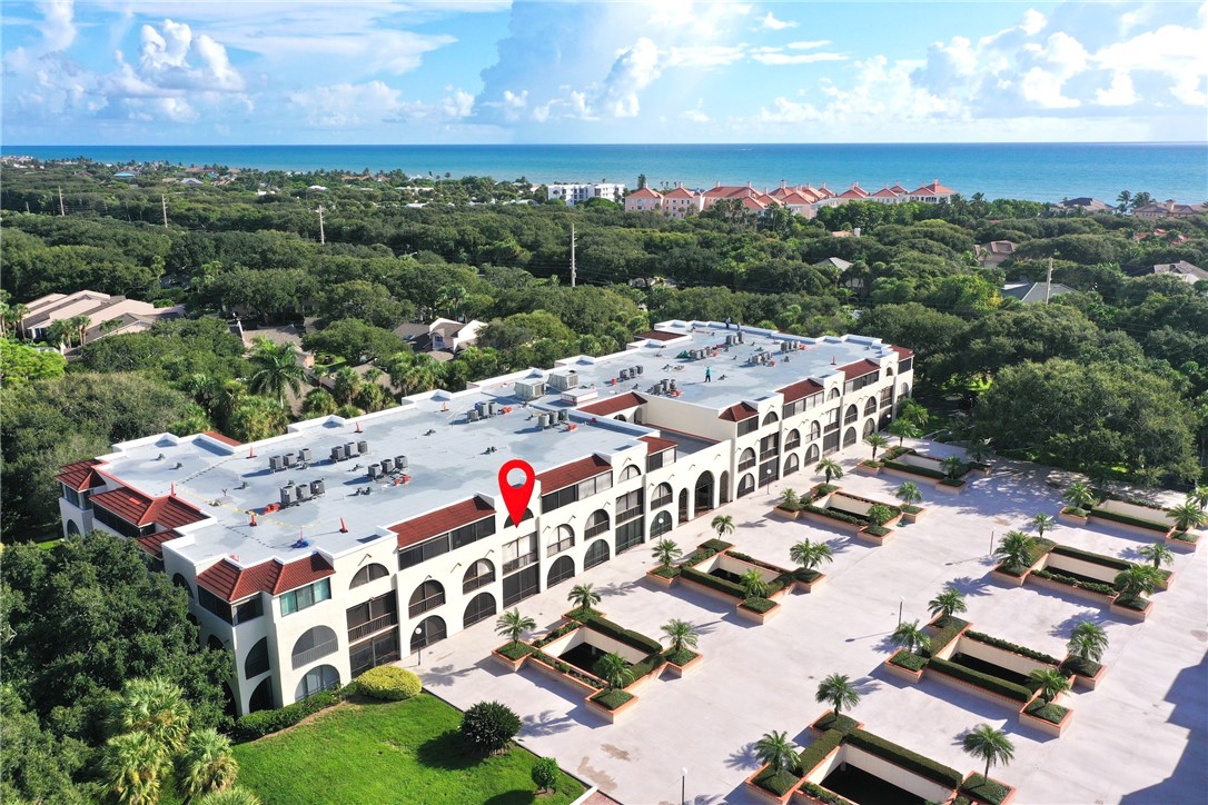 an aerial view of multiple house with yard