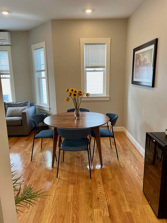 a workspace with furniture window and wooden floor