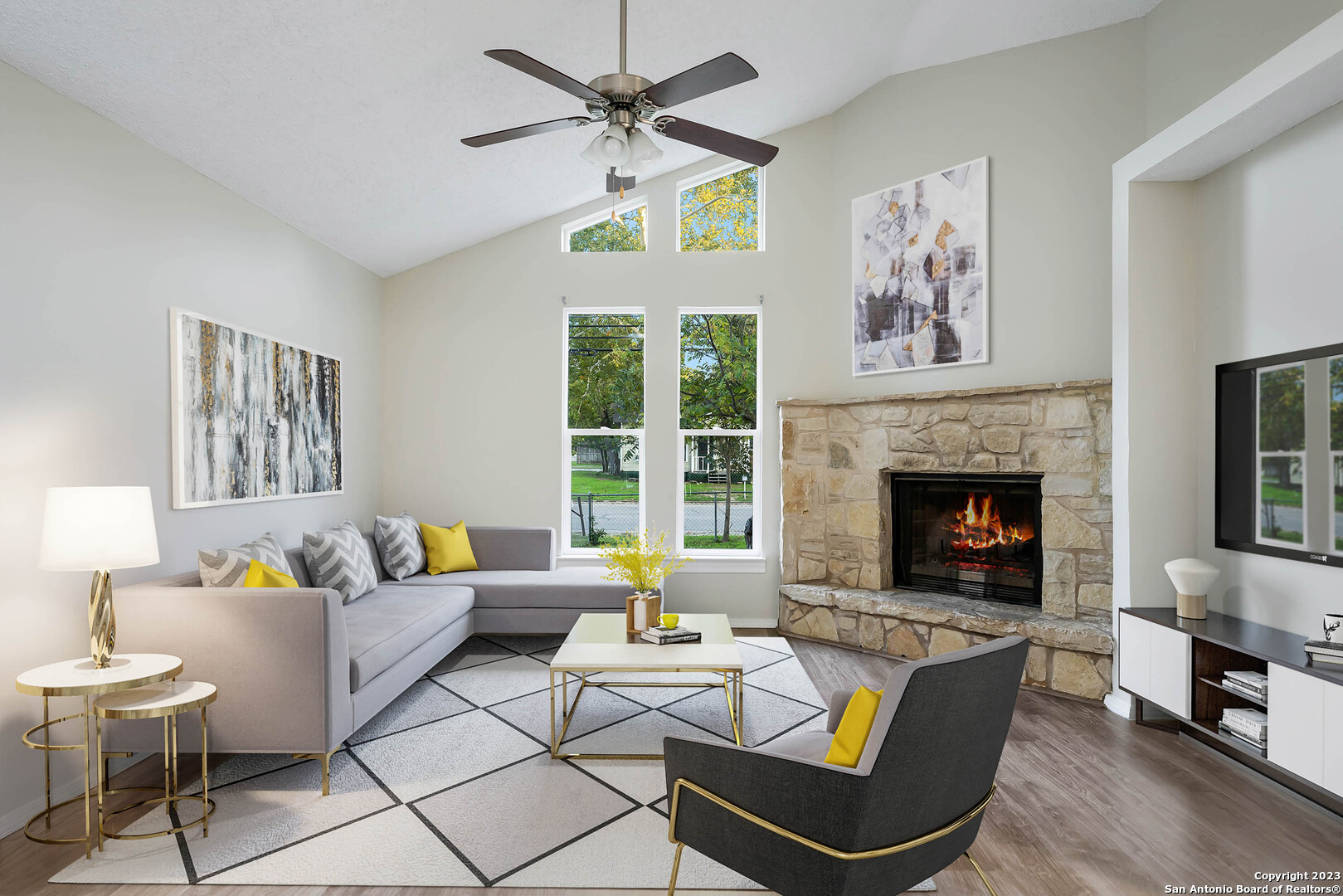 a living room with furniture and a fireplace