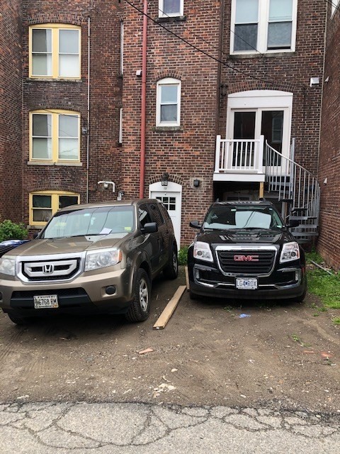 a view of a car parked in front of a building