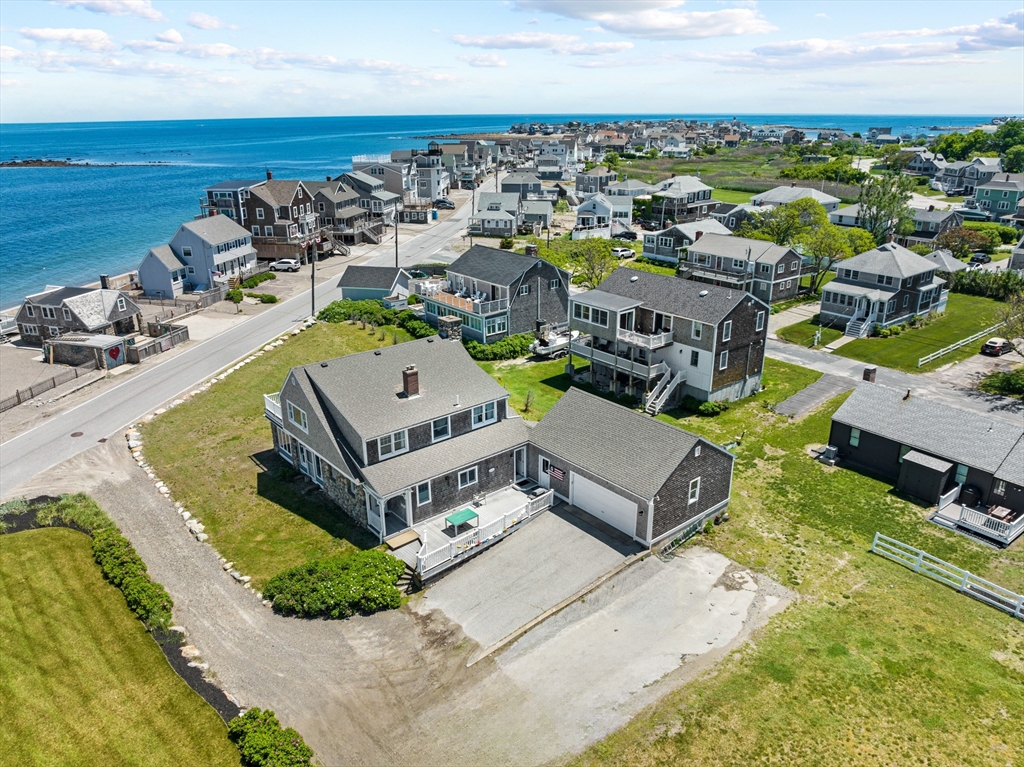 an aerial view of a house with a swimming pool