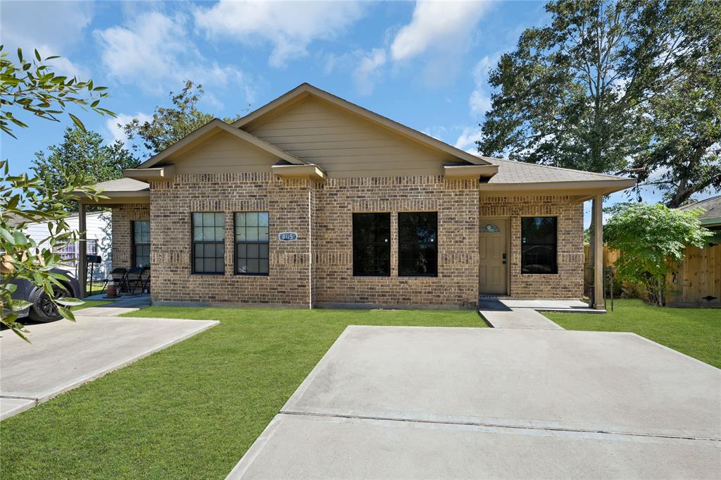 a front view of a house with a yard and porch