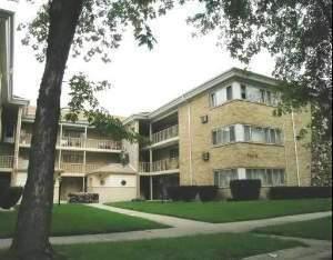 a front view of a building with garden