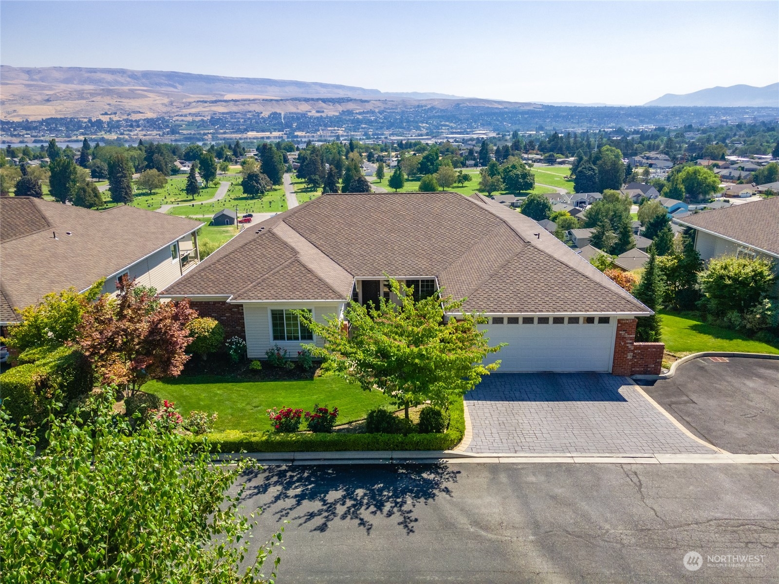 an aerial view of a house with a garden