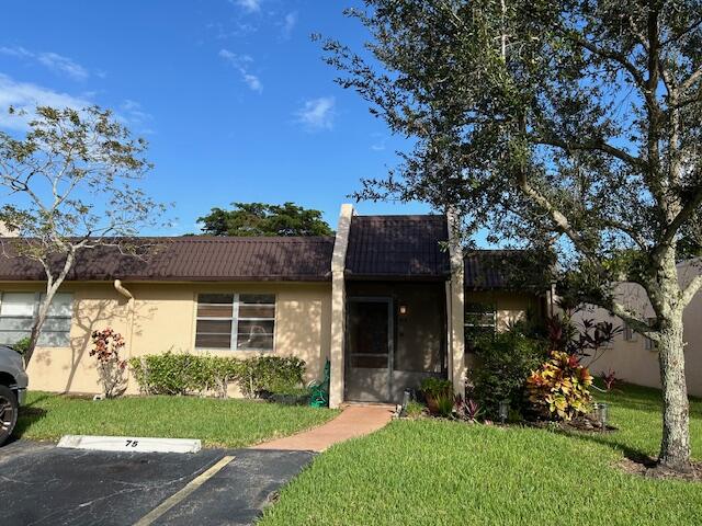 front view of a house with a yard