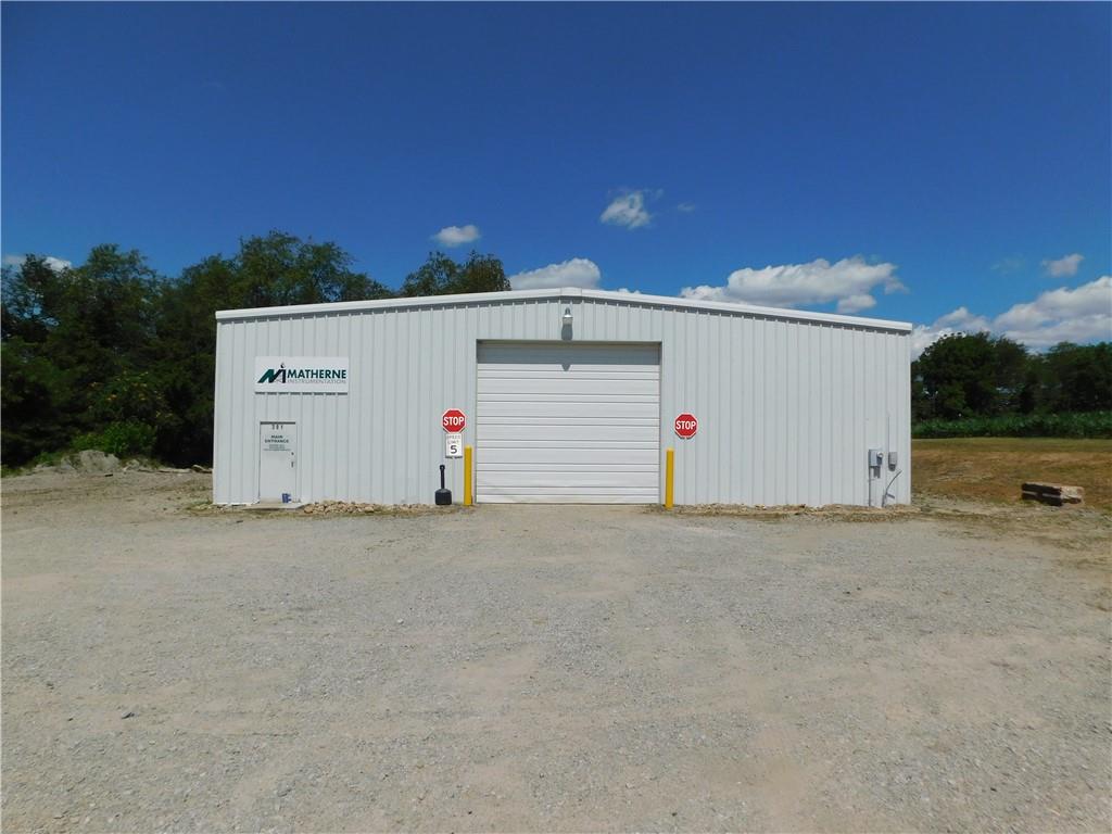 a view of garage and yard