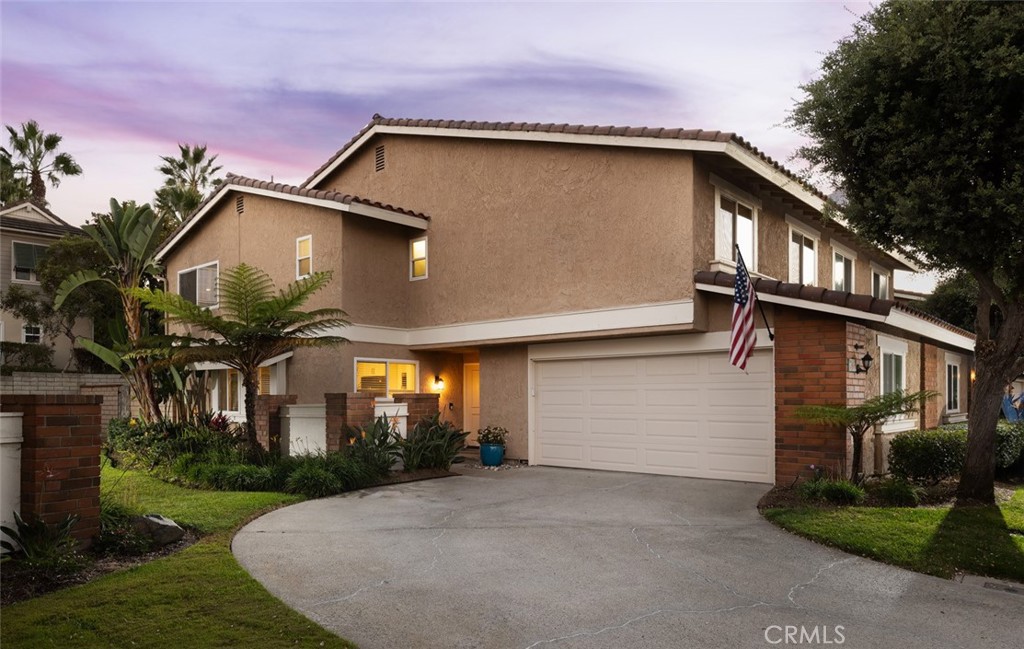 Front entrance, attached two-car garage, oversized driveway