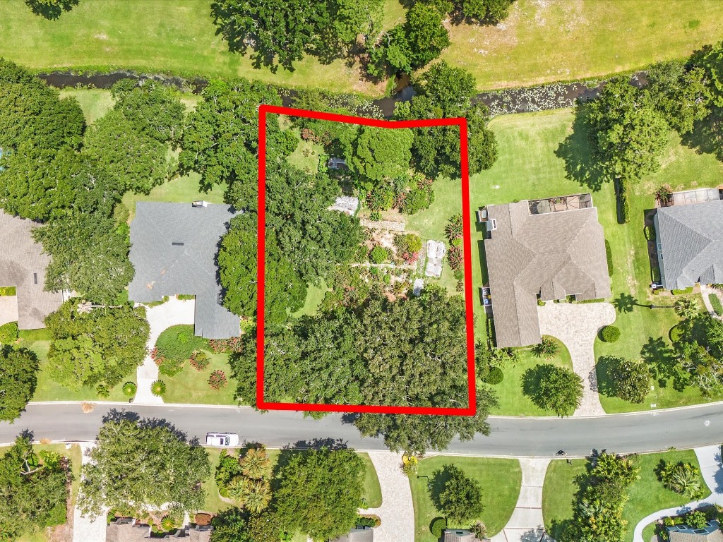 an aerial view of a house and outdoor space