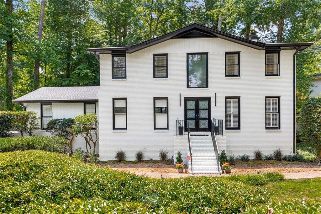 front view of a house with a yard