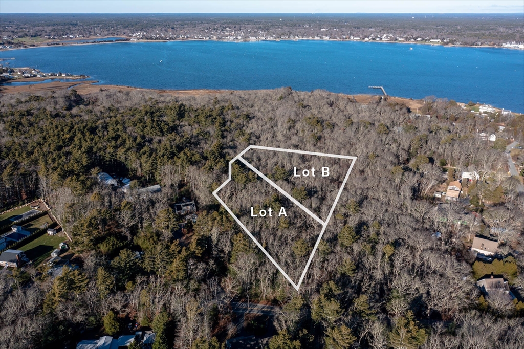 an aerial view of a house with a lake view