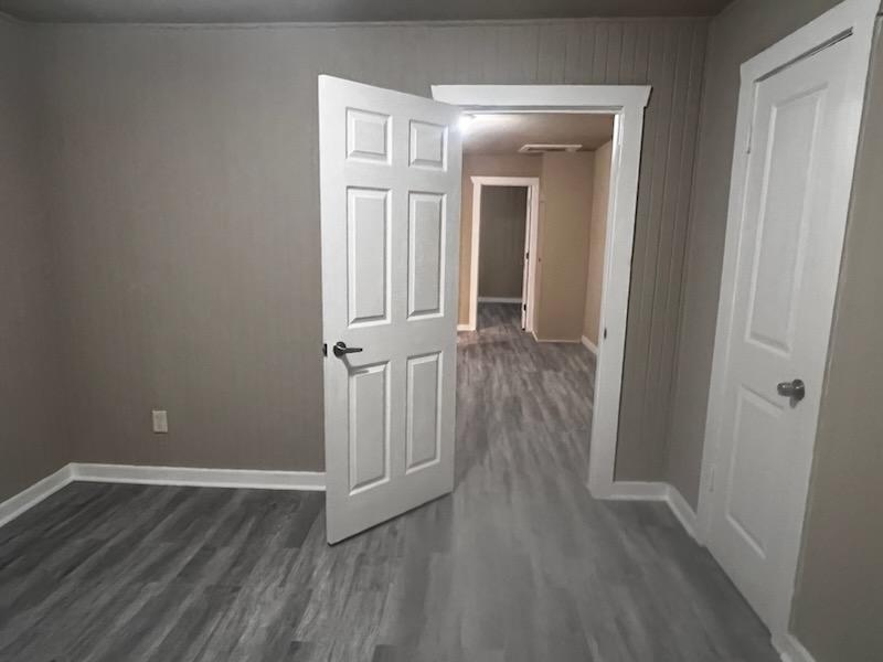 a view of a livingroom with wooden floor