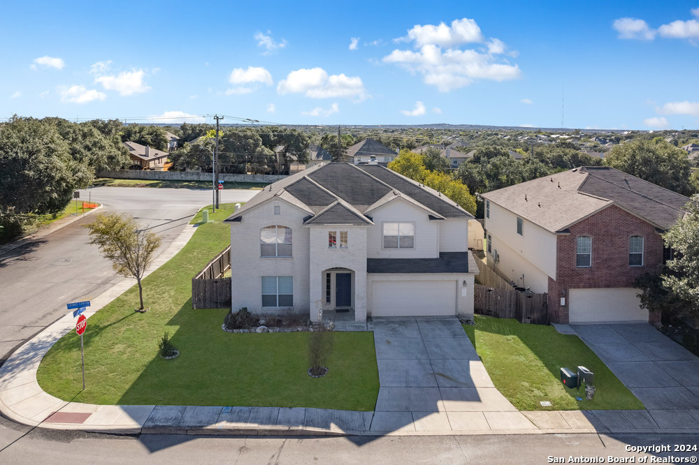 a view of a house with a yard