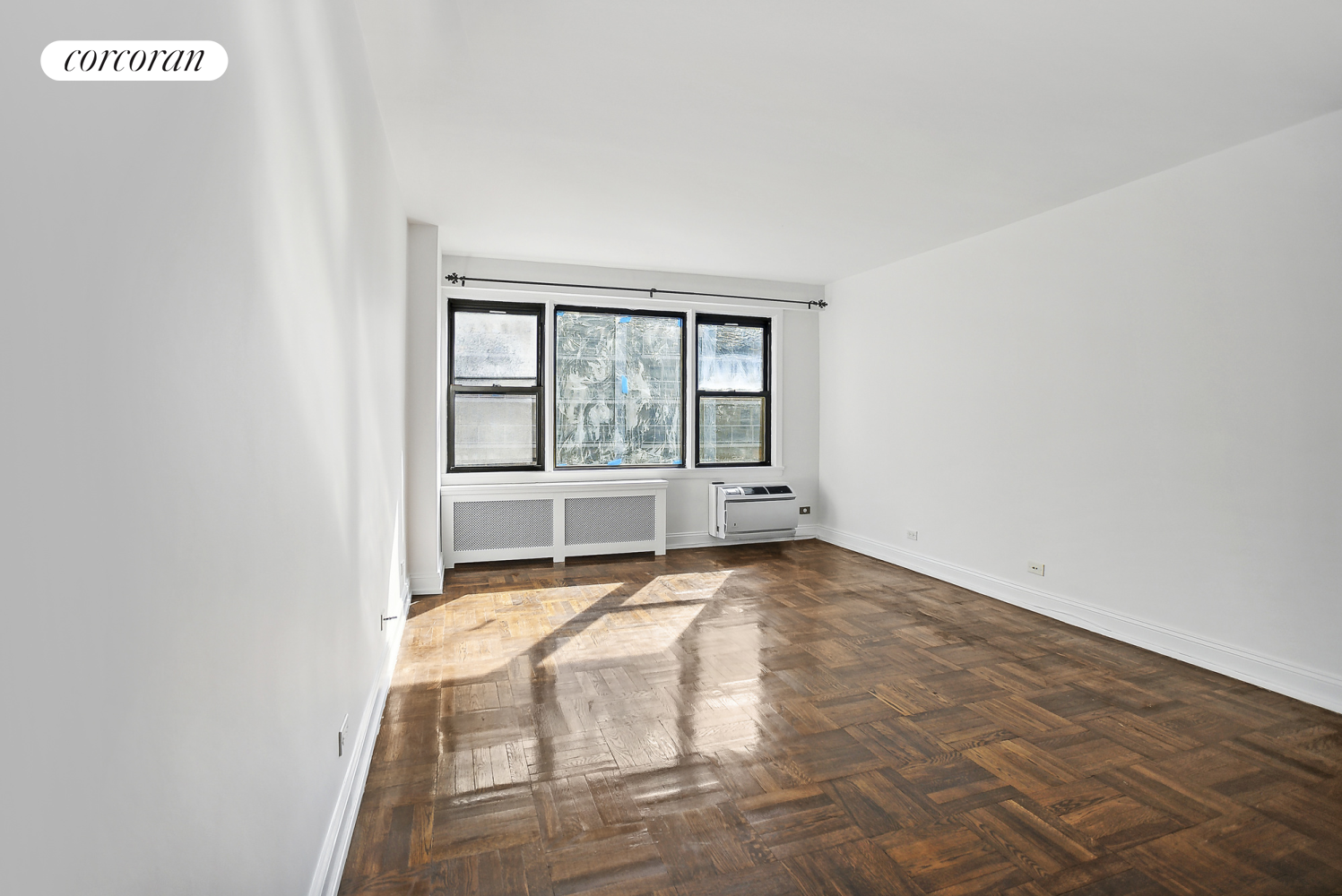 a view of an empty room with a window