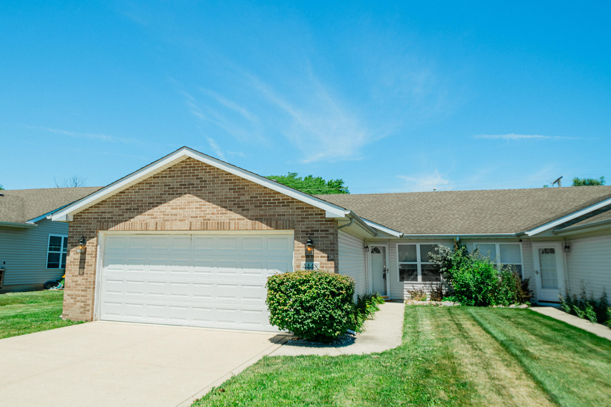 front view of a house with a yard