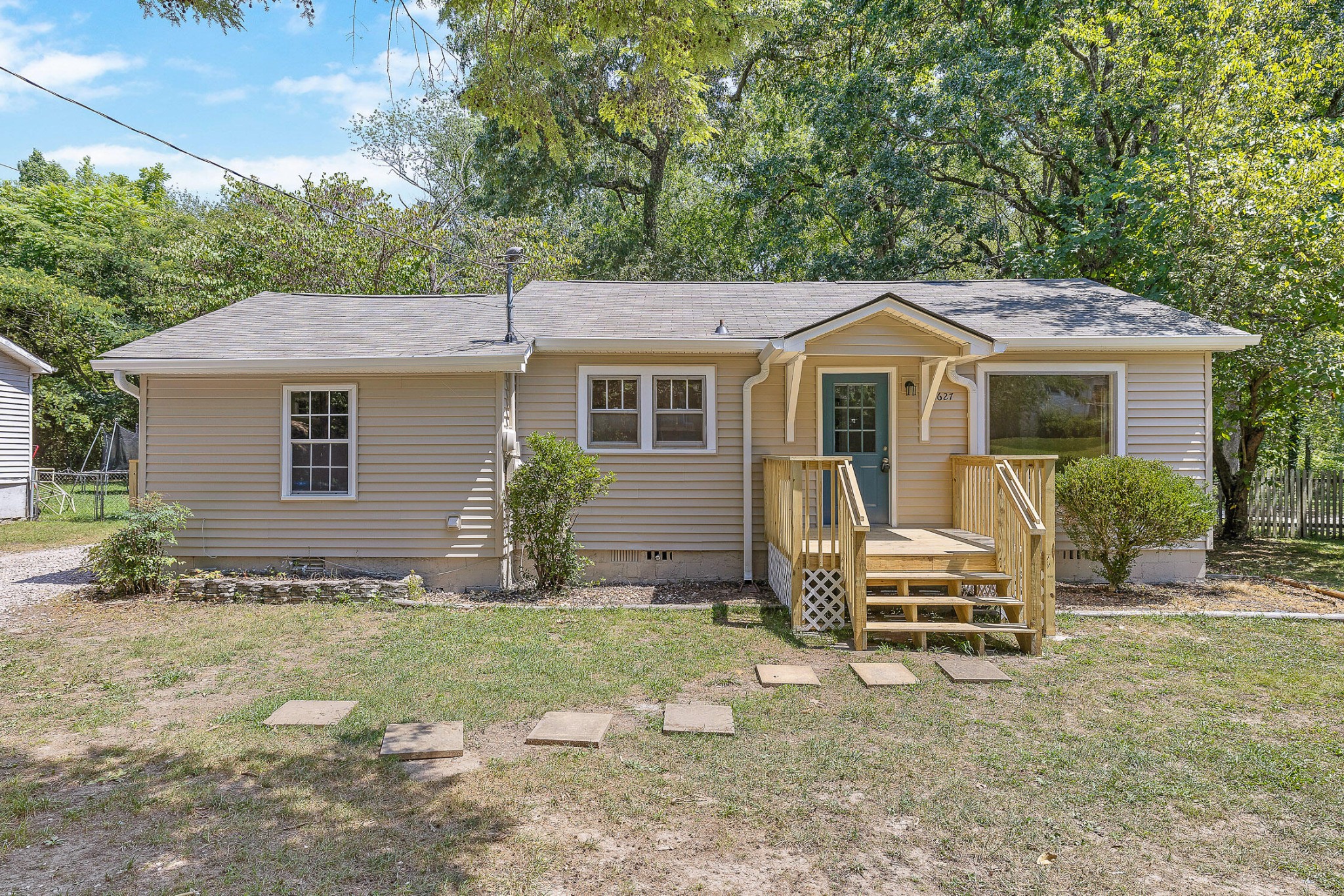 a front view of a house with garden