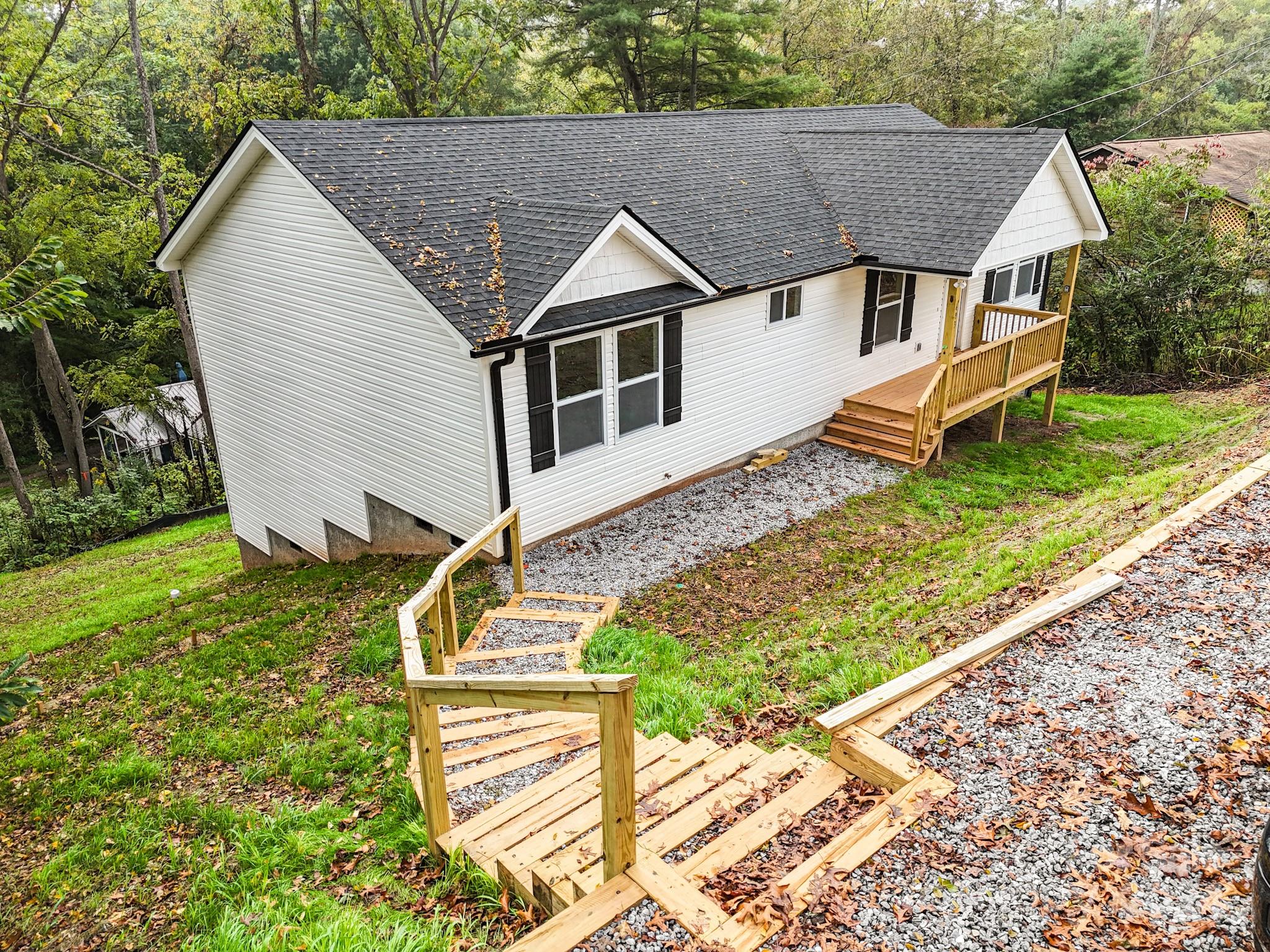 a aerial view of a house with a yard