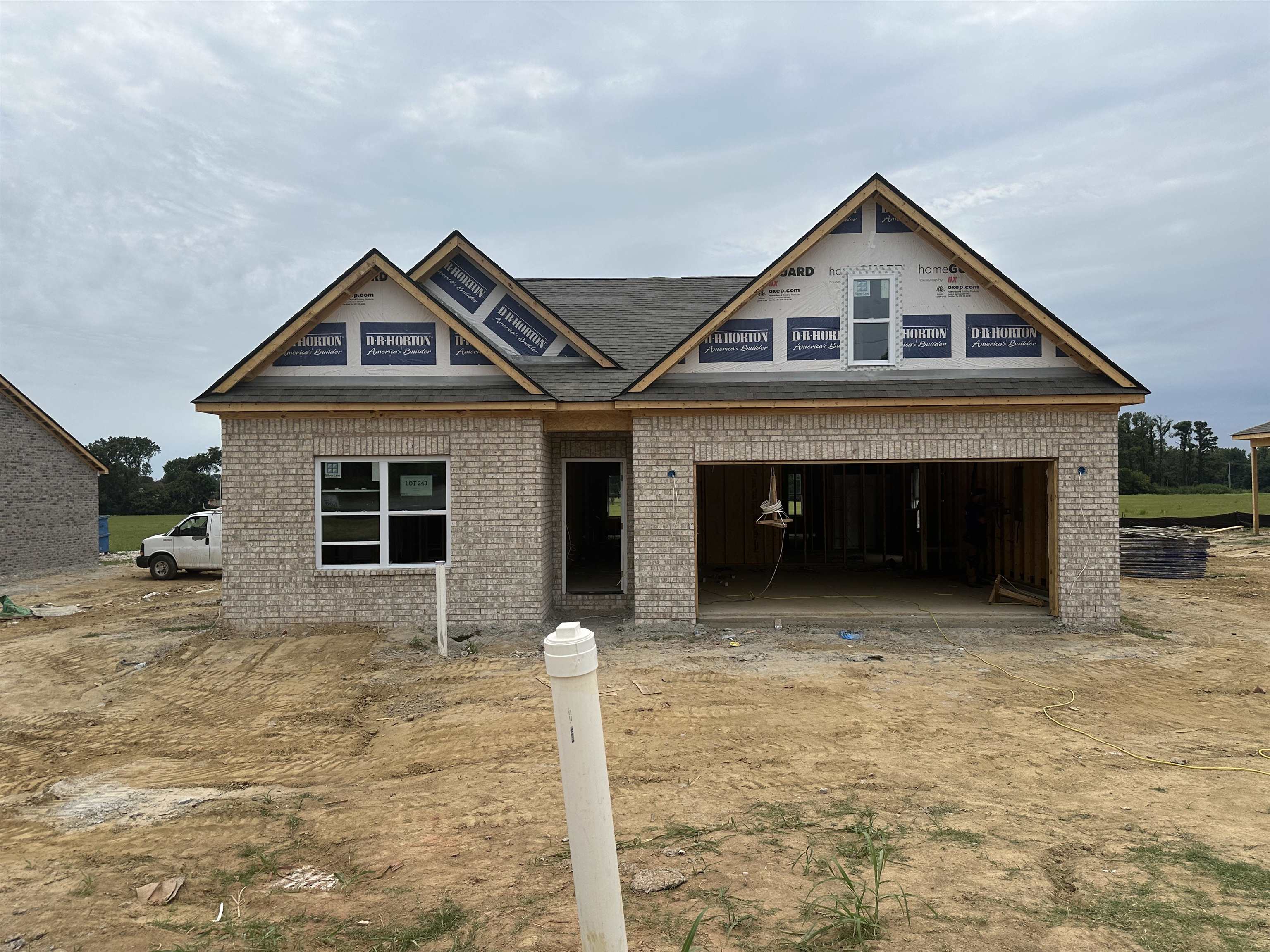 a front view of a house with yard