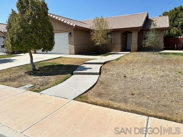 a front view of a house with yard