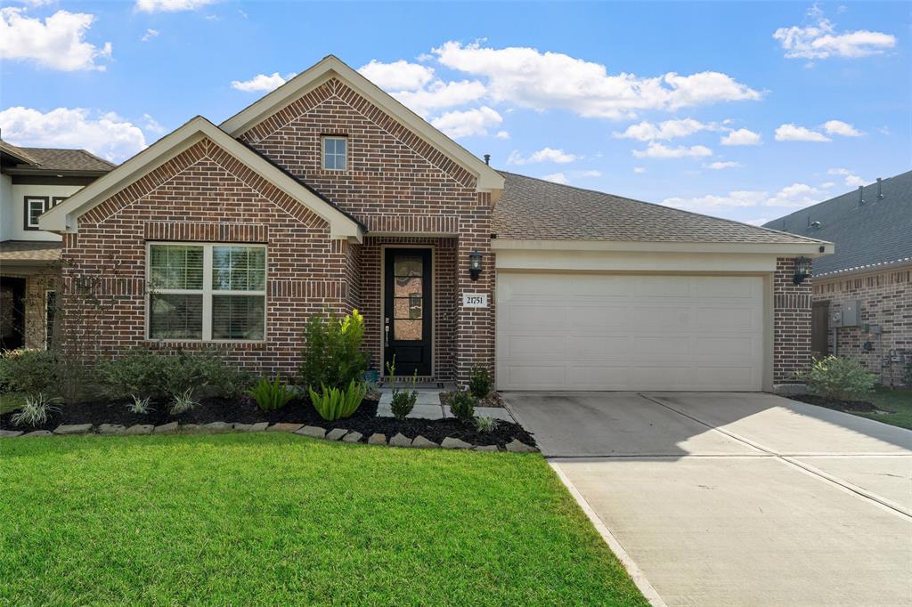 This listing boasts perfect curb appeal with its beautifully manicured landscaping, inviting entryway, and charming architectural details that make it stand out.