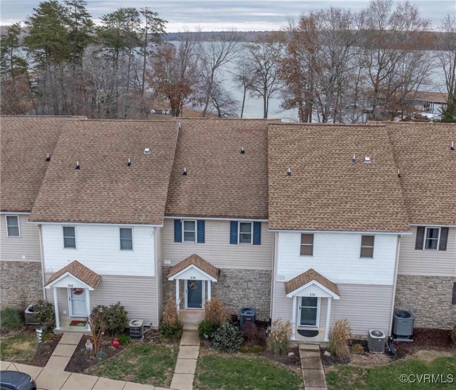 a aerial view of a house with a yard and garage