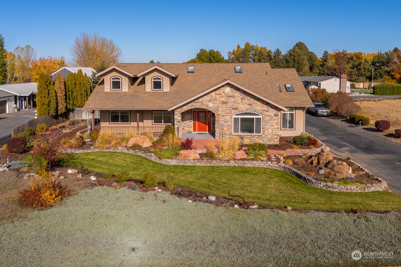 a front view of a house with garden