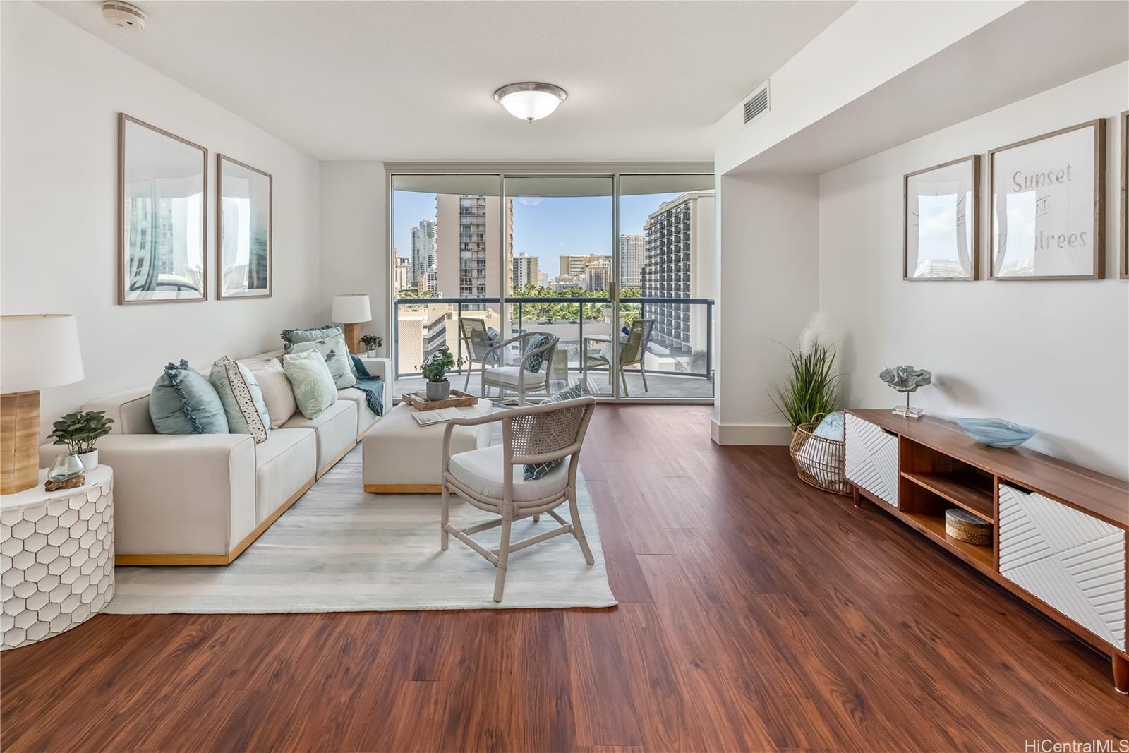 a living room with furniture and wooden floor