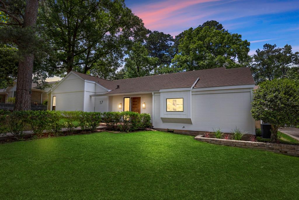 a house that is sitting in the grass