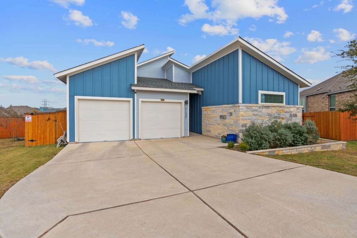 a front view of house with garage and yard