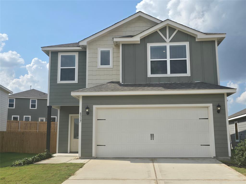 a front view of a house with a garage