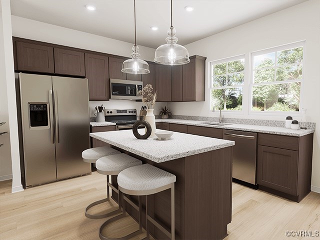 a kitchen with kitchen island a sink dining table and chairs