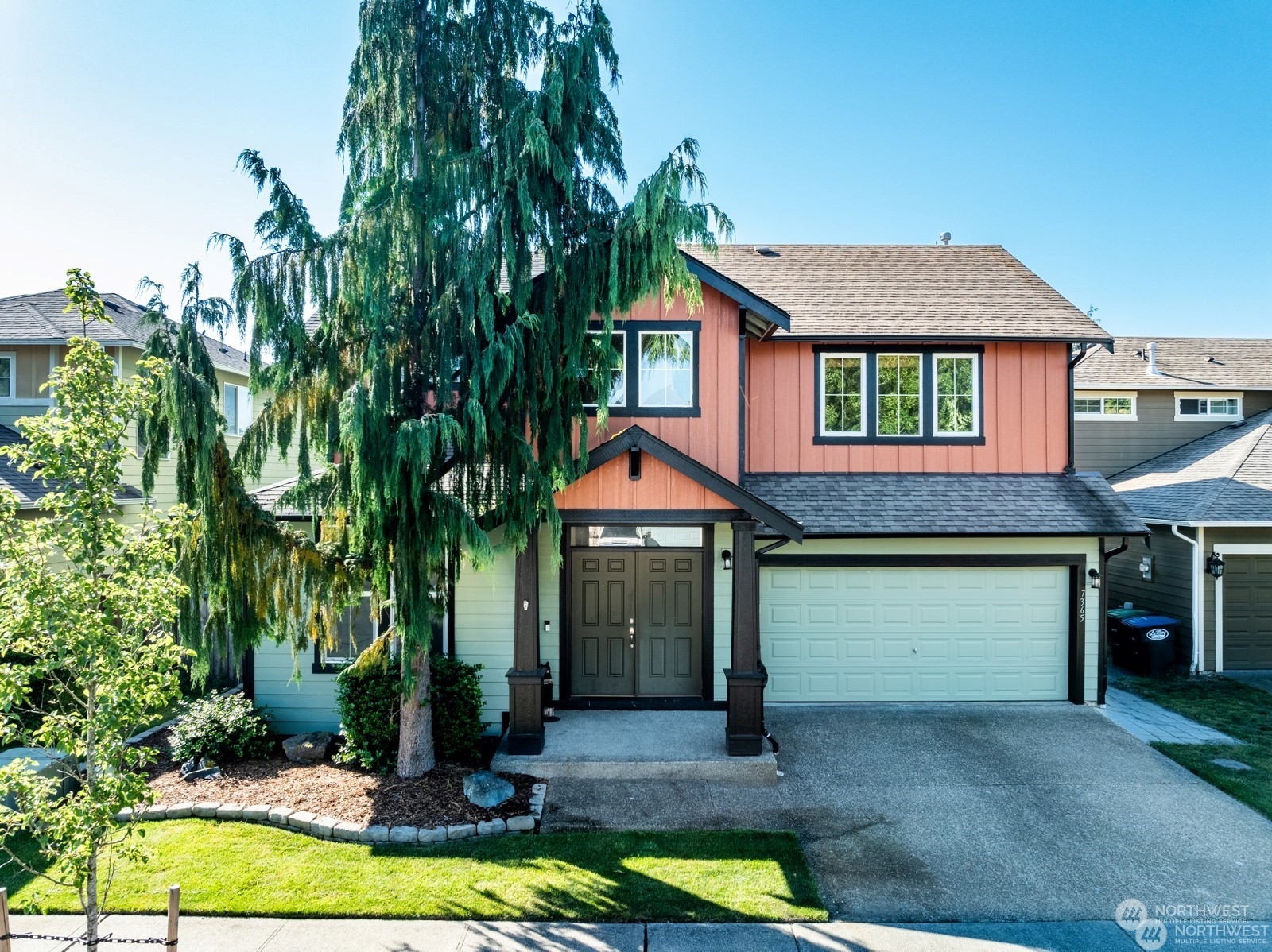 a front view of a house with a yard