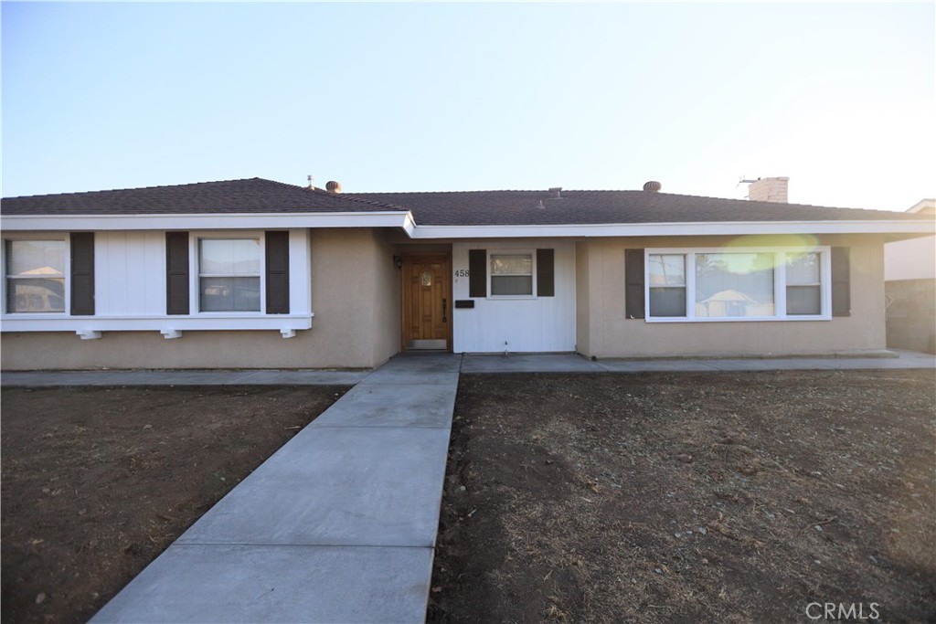 a front view of a house with yard