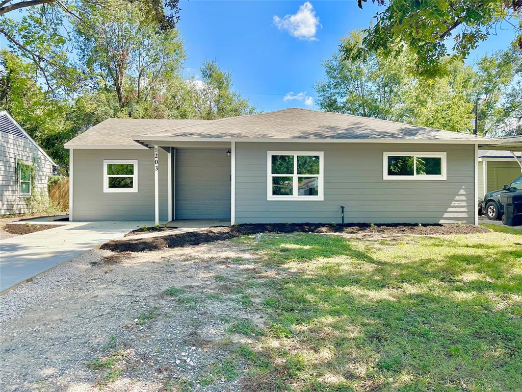 a house with trees in the background