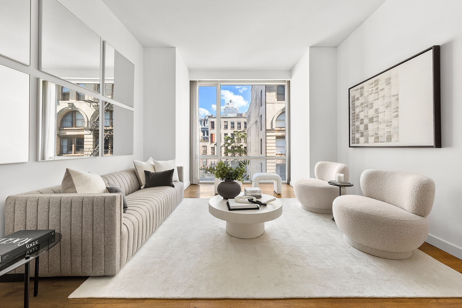 a living room with furniture and a potted plant