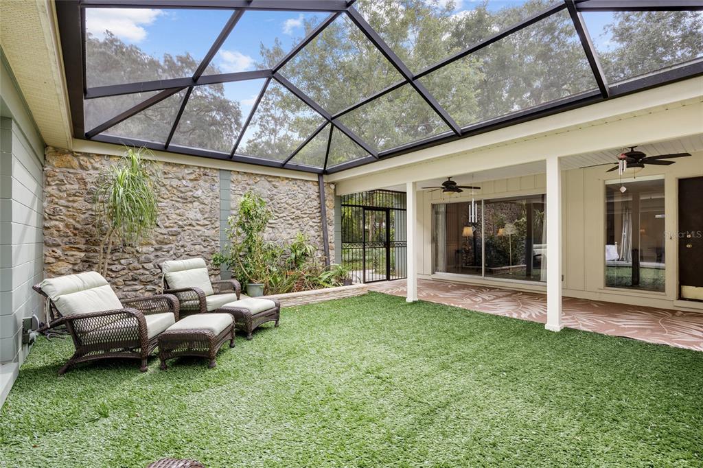 a living room with furniture and a garden