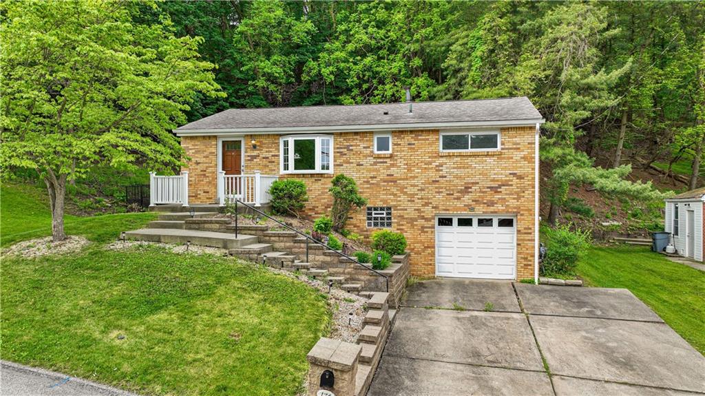 Welcome to 176 Springwood Drive located in the Forest Knoll subdivision.  Note the wide driveway!