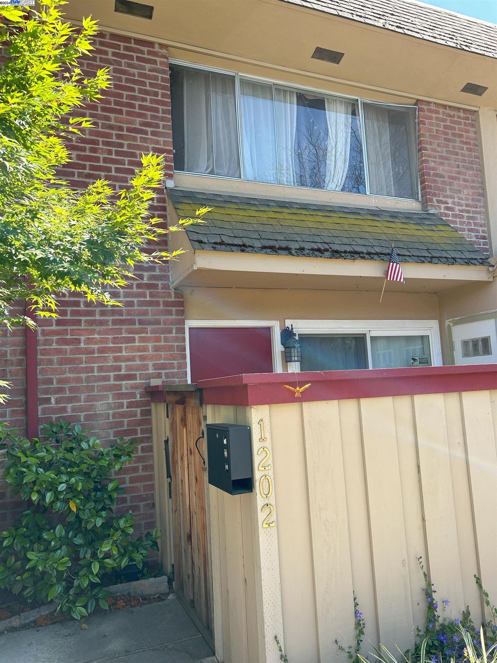 a view of a house with a small yard