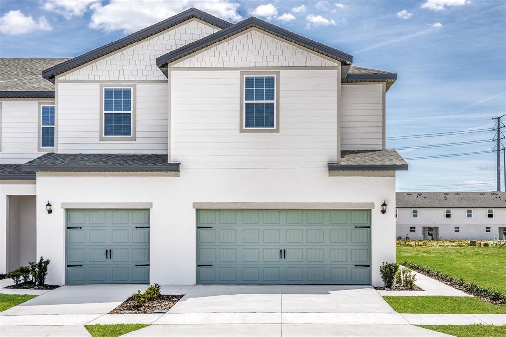 a view of a house with garage