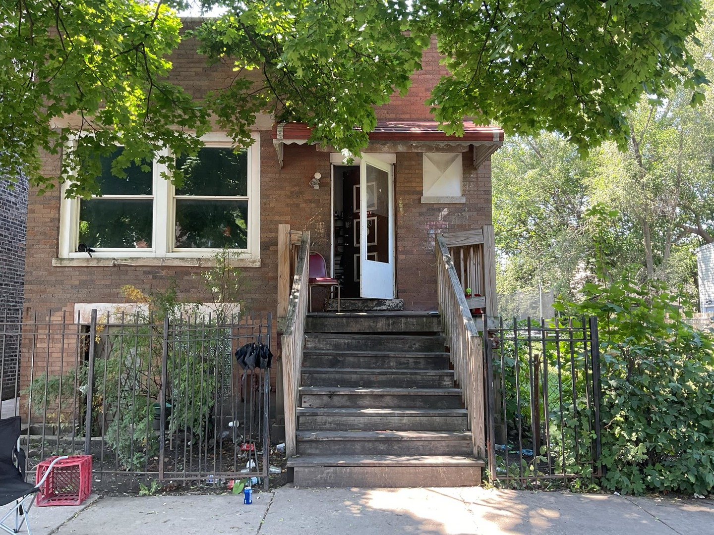 front view of a house with a tree