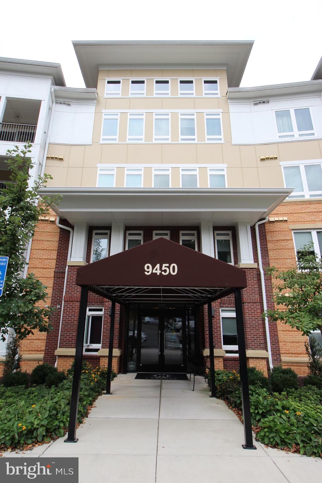 a front view of a brick building with many windows