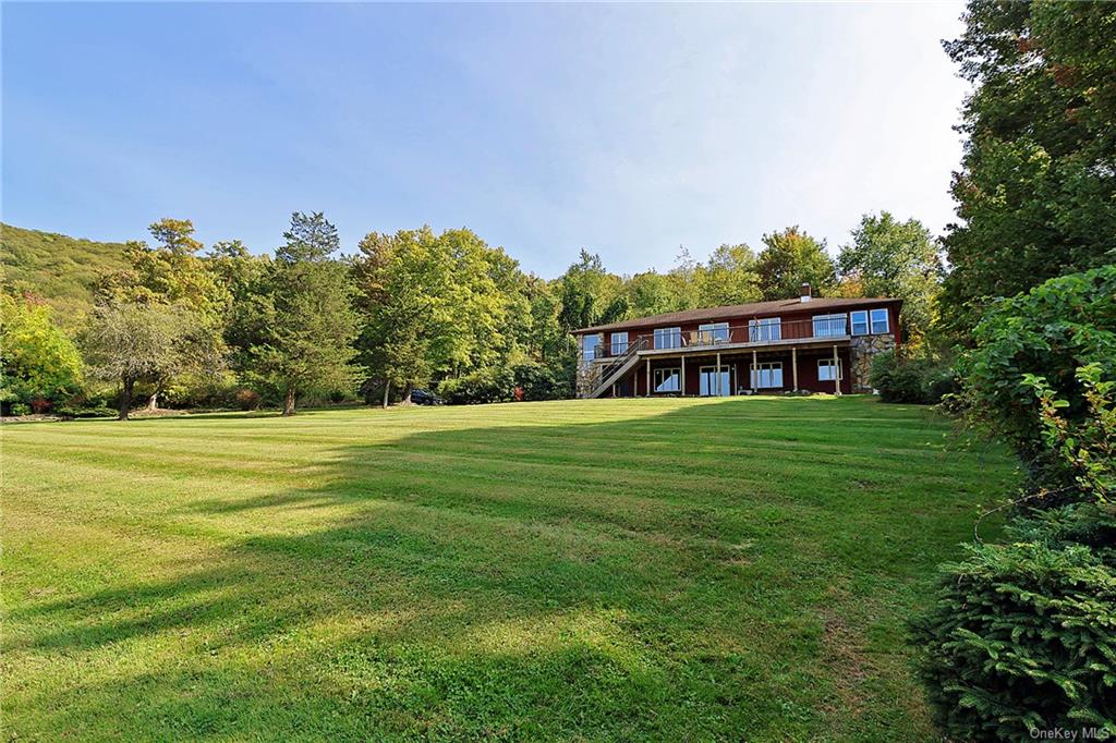 a view of a house with a big yard