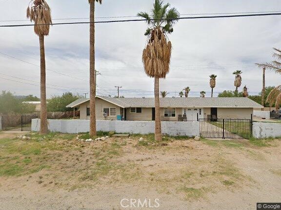 a view of a house with a big yard and a chandelier