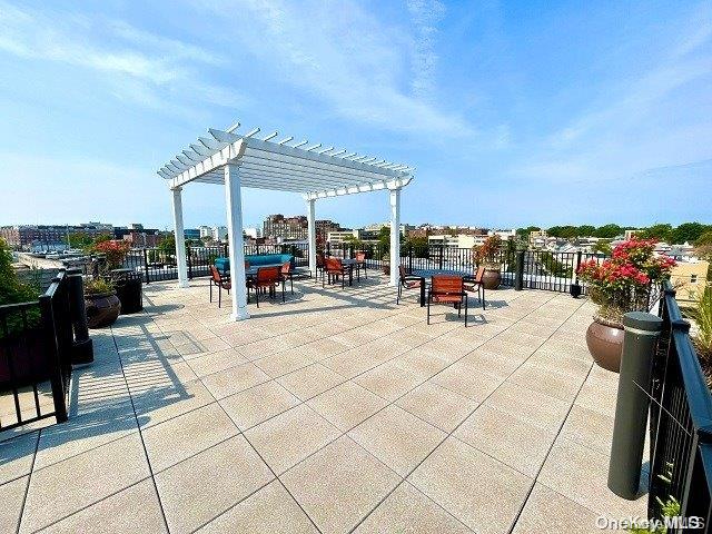 a view of a patio with dining table and chairs