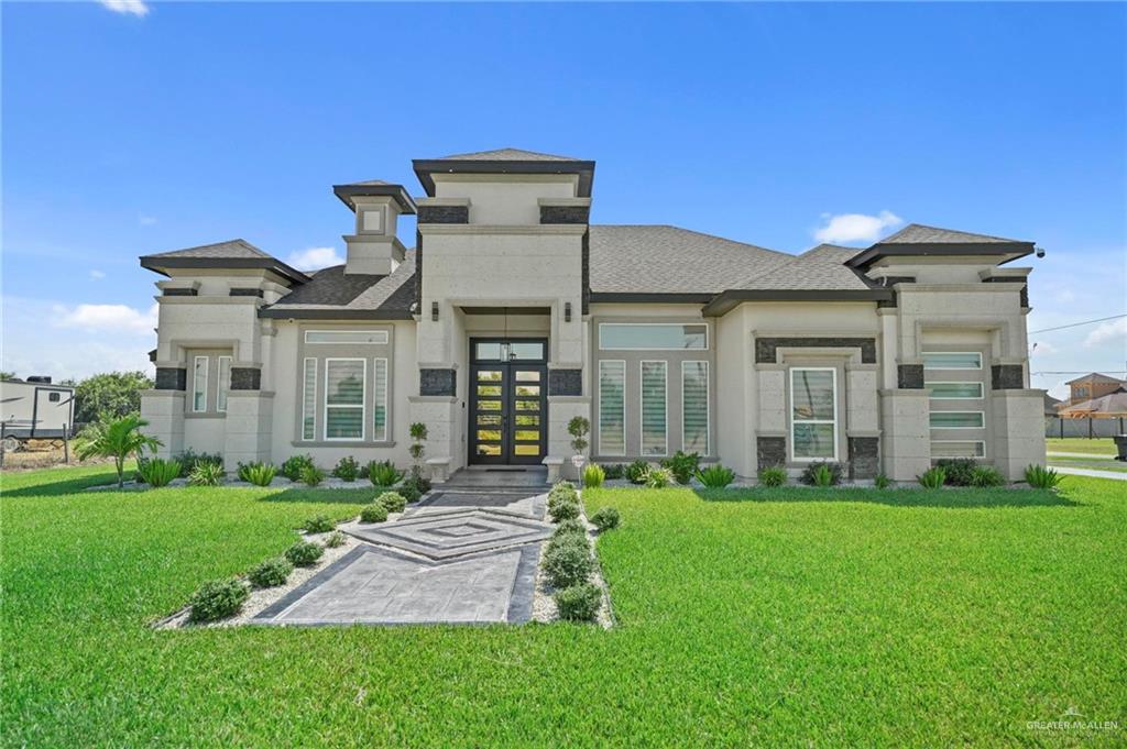 a front view of a house with a yard