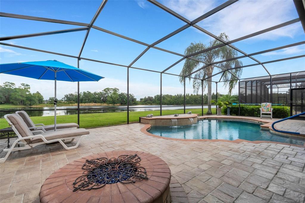 a view of a swimming pool with a patio