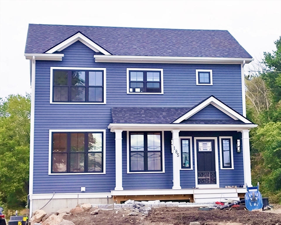 a front view of a house with glass windows