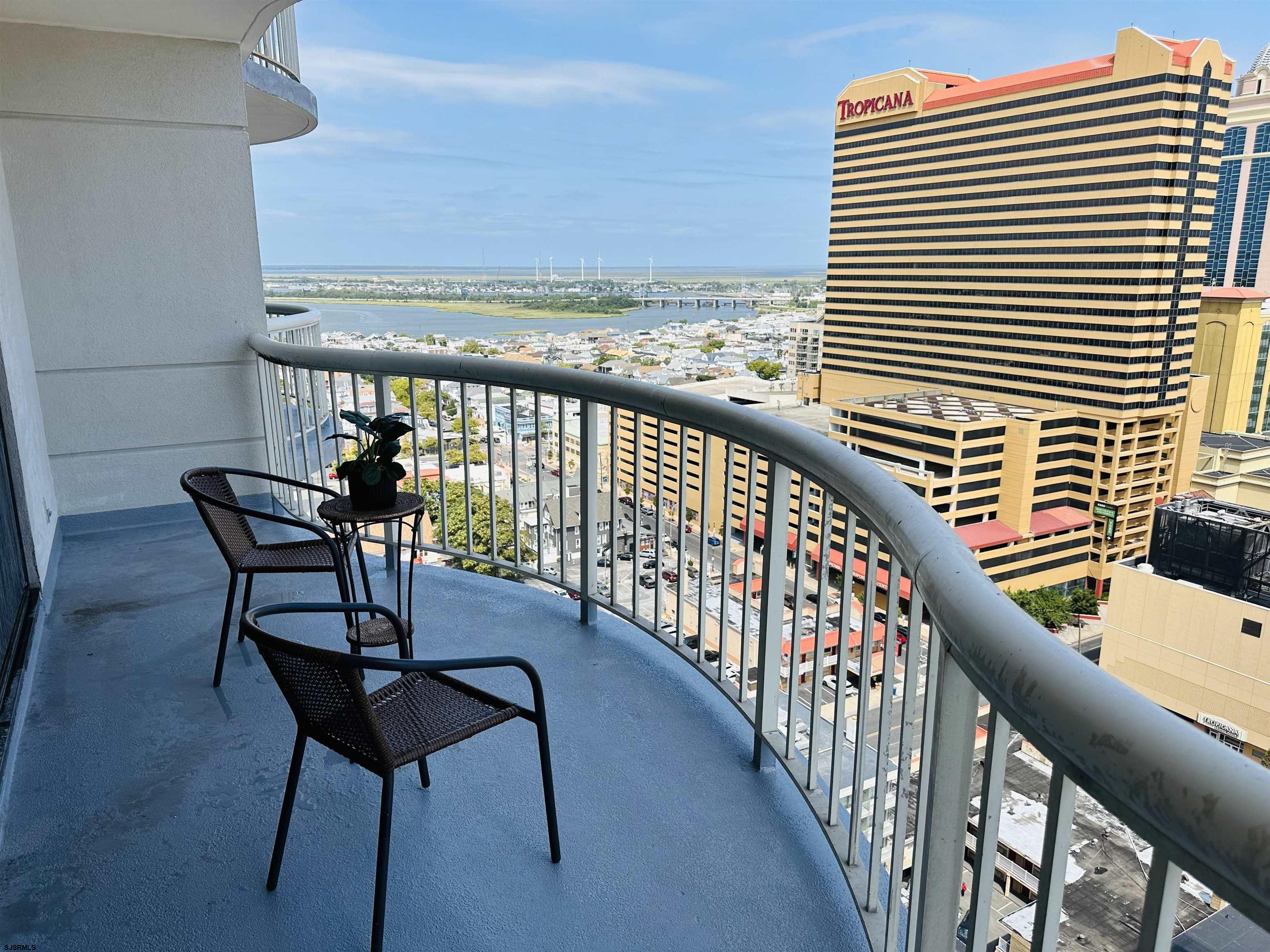 a view of a balcony with chairs